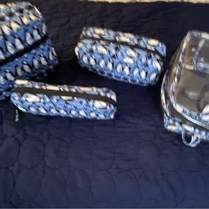 Vera Bradley three-piece cosmetic bag travel set.